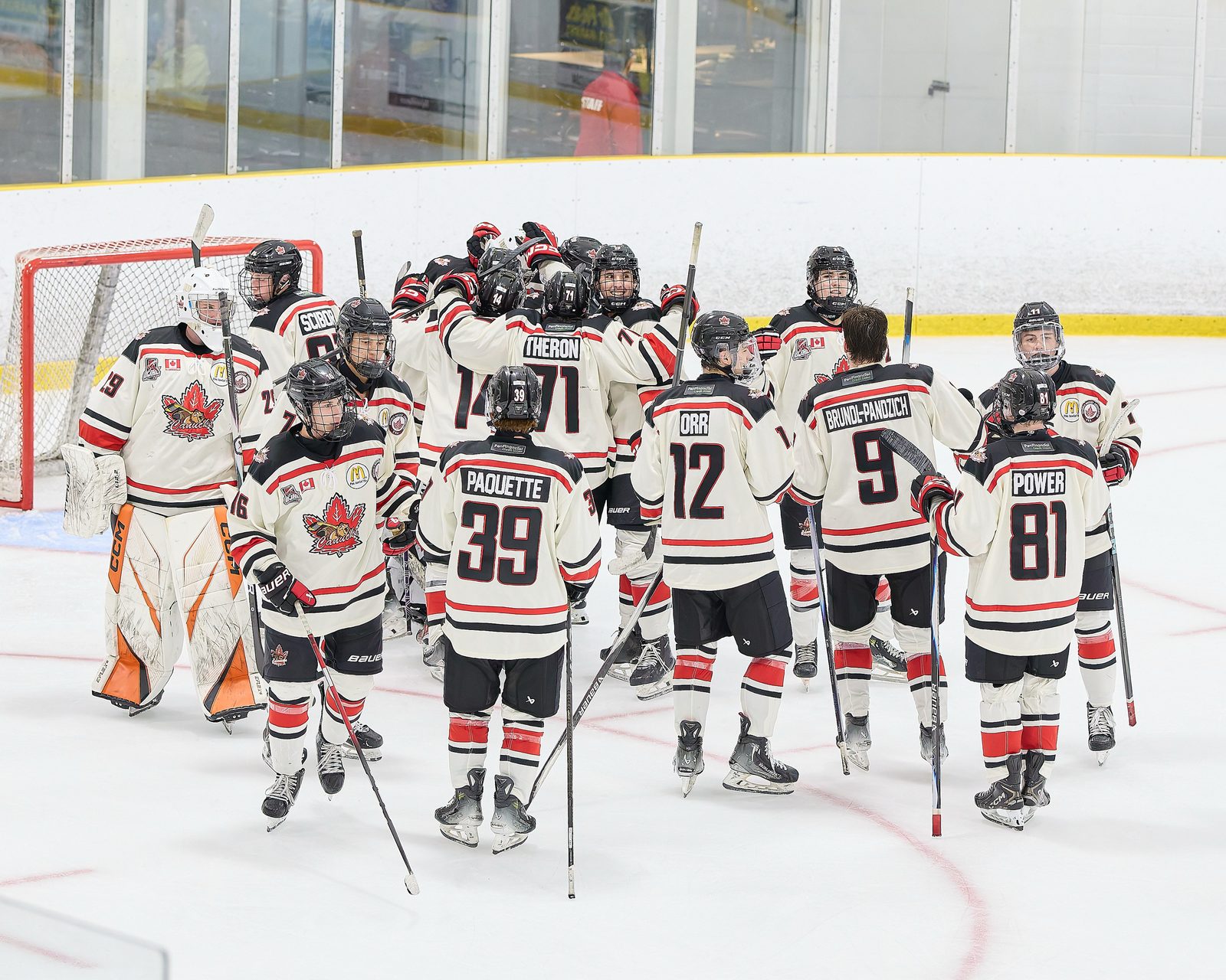 Niagara Falls Canucks players gather on the ice during an Ontario Junior Hockey League game against the Toronto Patriots, October 4, 2025. (Photo by OJHL Images)